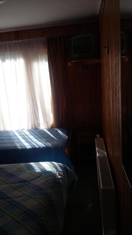 Postel nebo postele na pokoji v ubytování Hostal Costa Azul