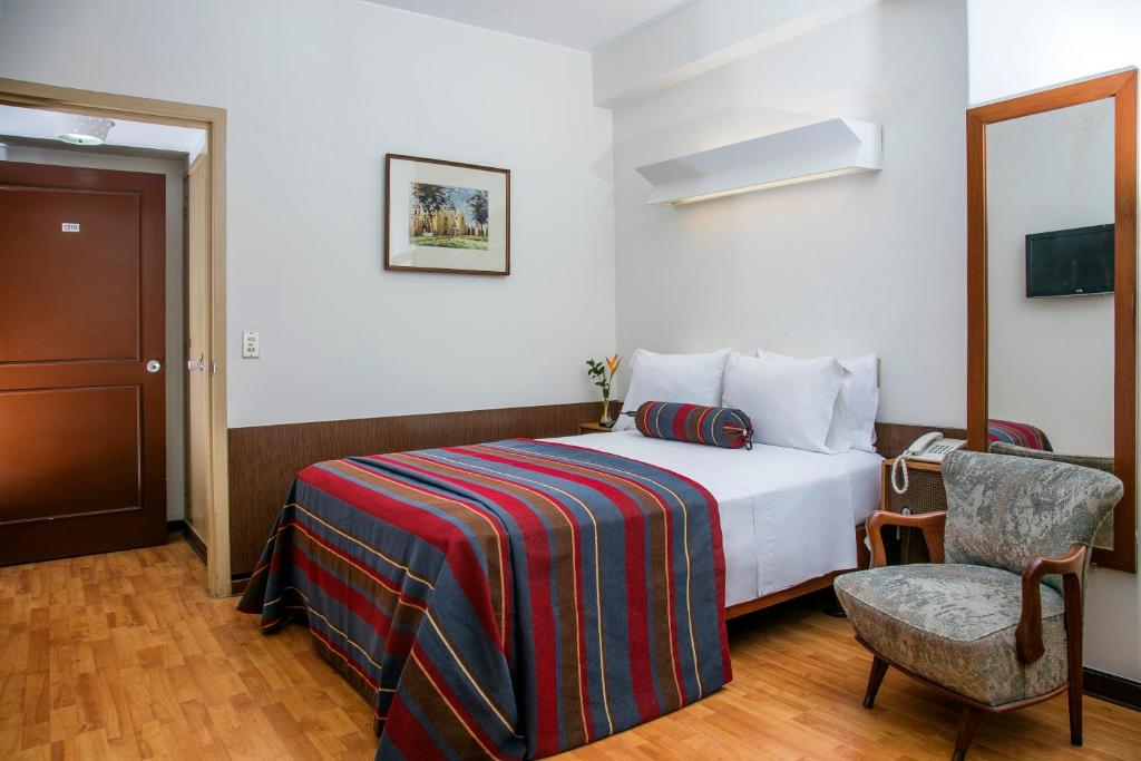 Ein Bett oder Betten in einem Zimmer der Unterkunft San Agustin Riviera