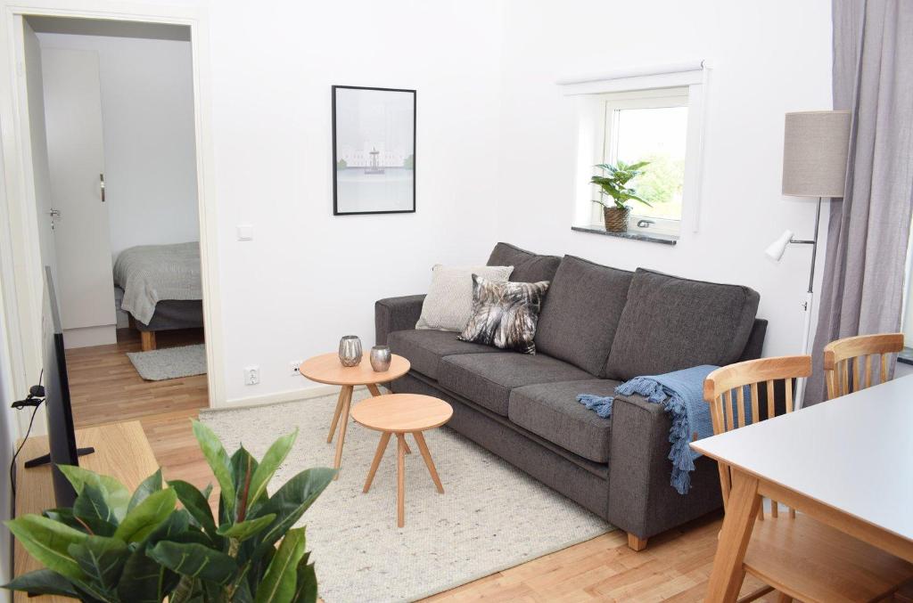 a living room with a couch and a table at Apartments Lund in Lund