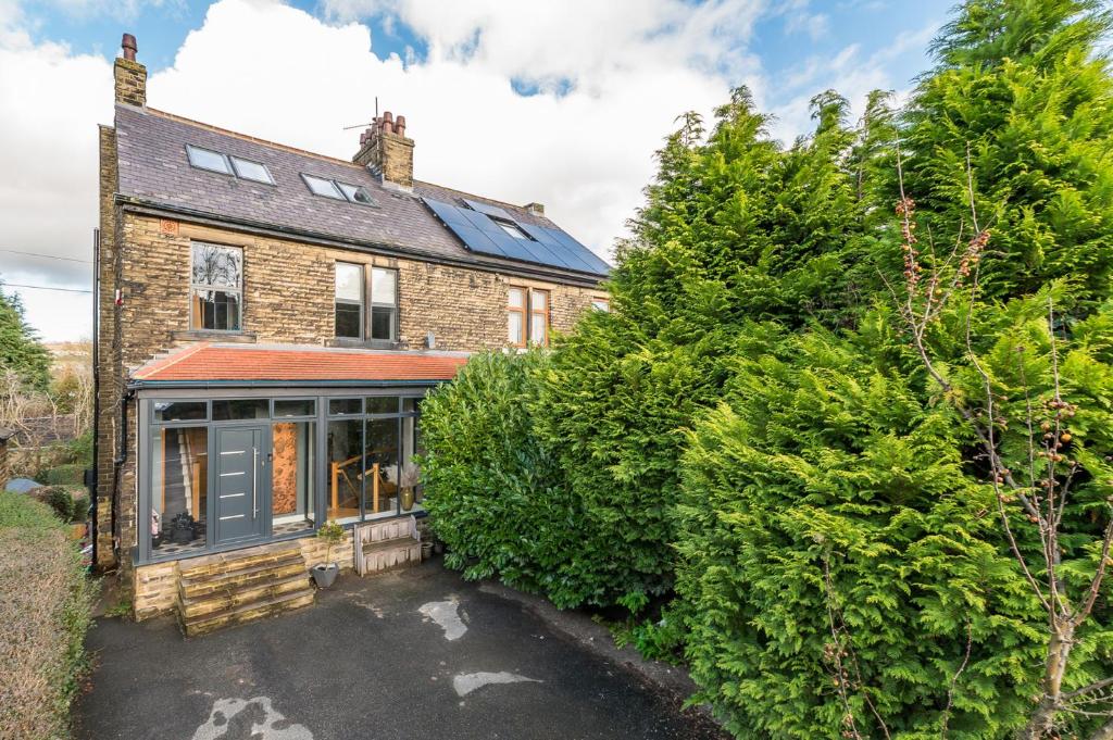 an exterior view of a brick house at The Grand Weave House in Shipley