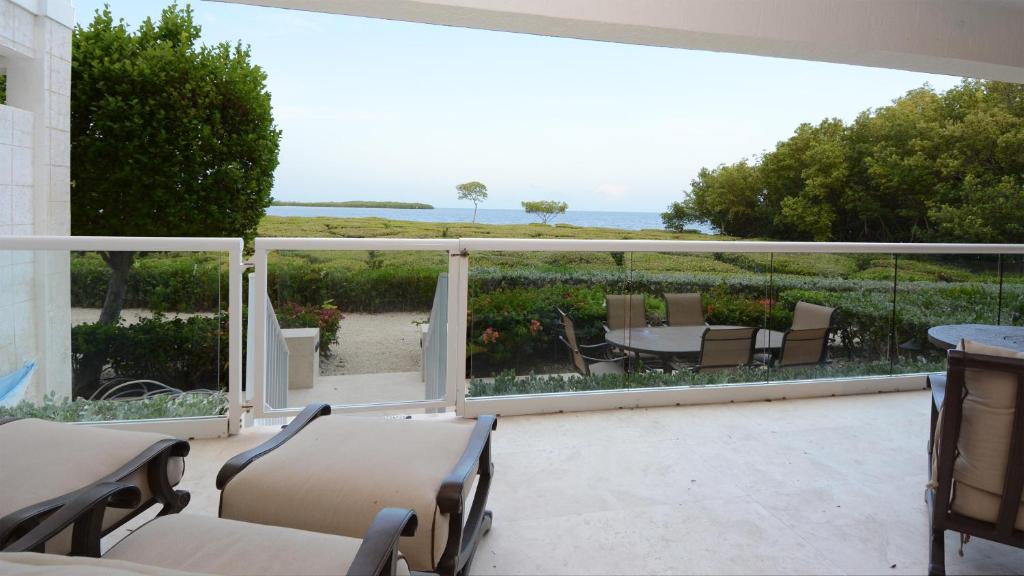 a balcony with a view of the ocean at 515 Mariners Club in Key Largo