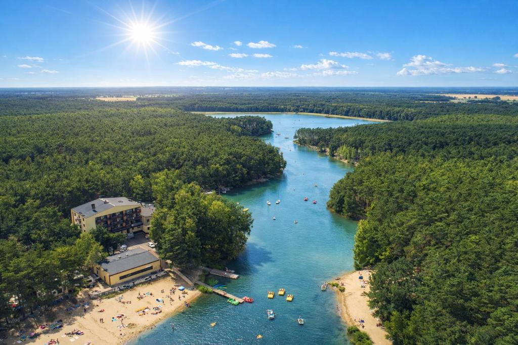 an aerial view of a river with a beach and boats at Nad Zalewem - pokoje przy plaży in Kobyla Góra