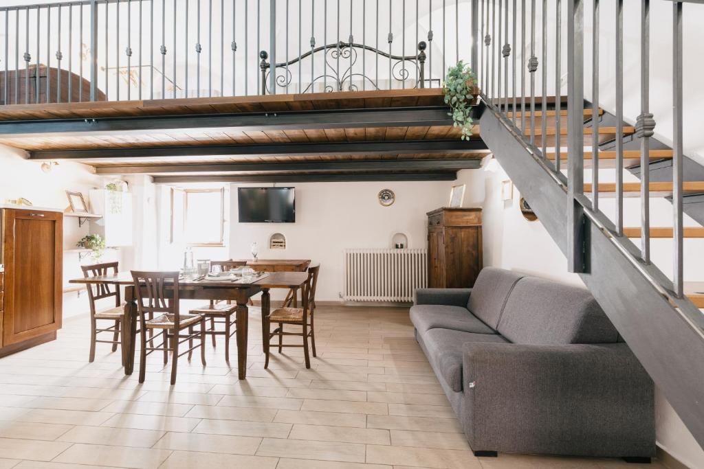 a living room with a couch and a table at BHR - Il Nido di Trevi in Trevi