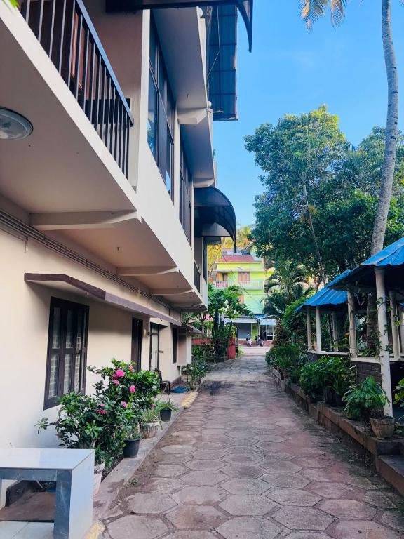 an empty street in front of a building at Panchavadi Beach Resort in Varkala