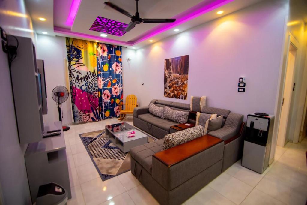 a living room with a couch and a table at New Villa Carimo in Quseir