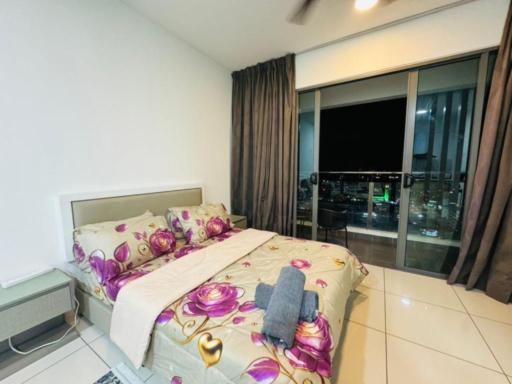 a bedroom with a bed and a large window at Evo studio soho mini apartment in Bandar Baru Bangi