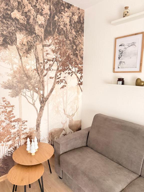 a living room with a couch and a table at Novelli Homes in Formigine