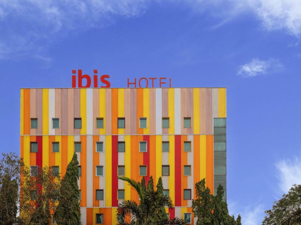 a building with the words bus hotel on top of it at ibis Navi Mumbai - An Accor Brand in Navi Mumbai