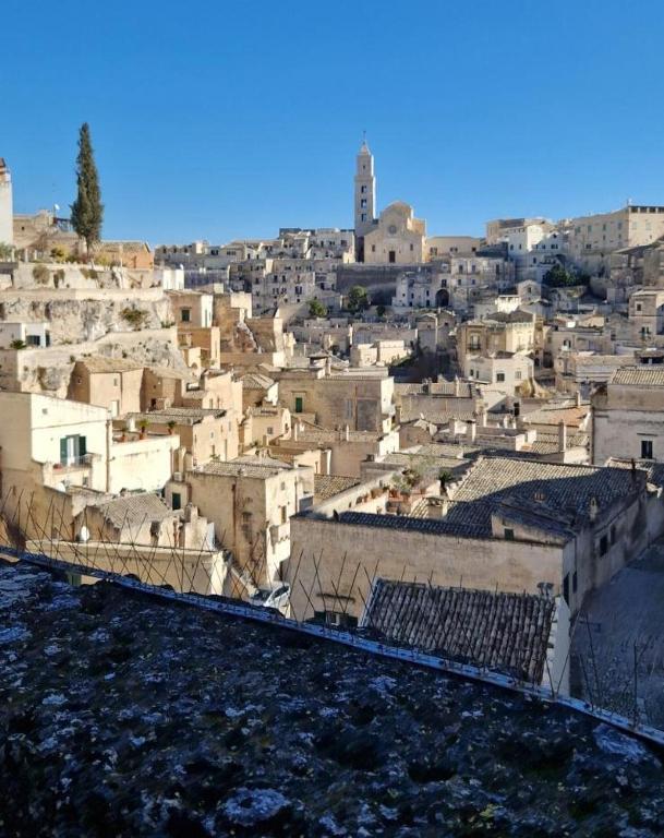 a view of a city with a bunch of buildings at Vistasassi rooms in Matera