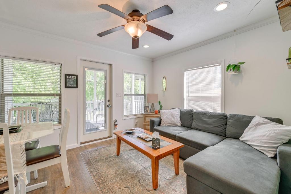 a living room with a couch and a ceiling fan at Pool & Lake Access! Sherrills Ford Tiny Home in Sherrills Ford