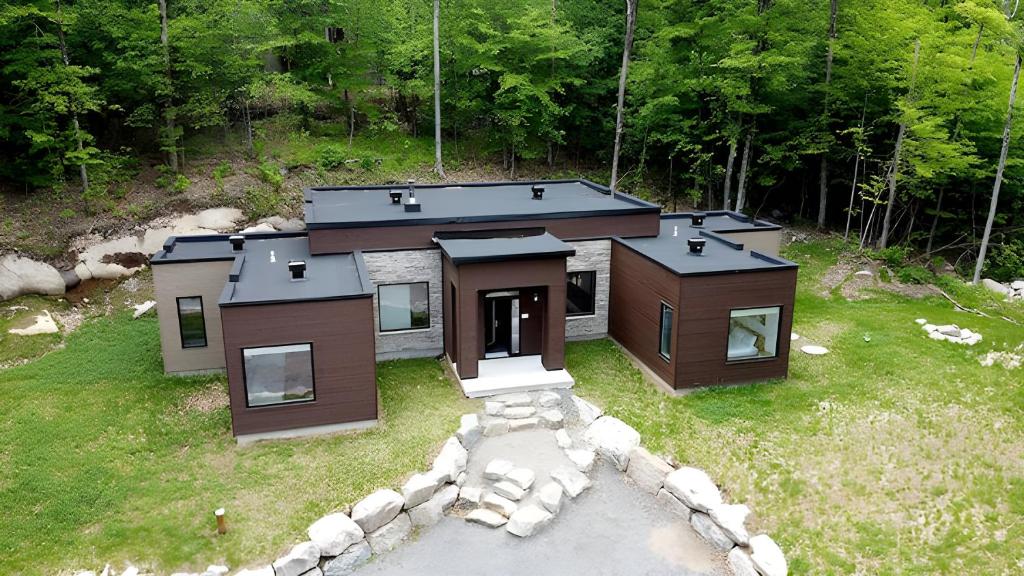 an aerial view of a small house in a field at Modern Luxury Chalet Private Jacuzzi in La Conception
