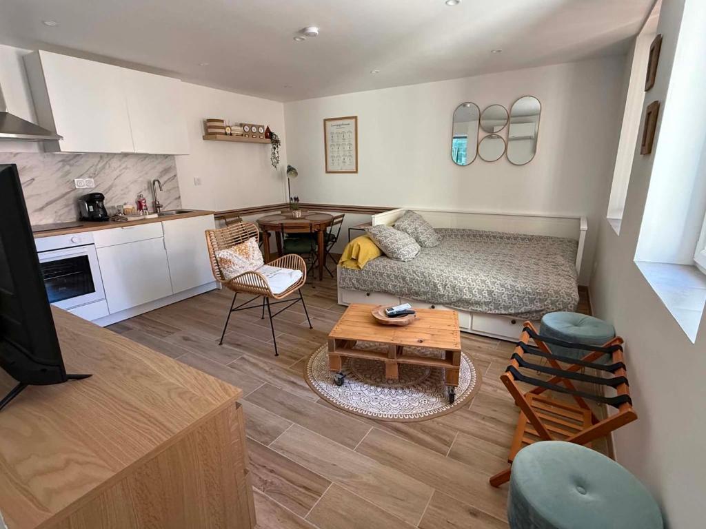 a living room with a couch and a table at Umalas studio in Orange