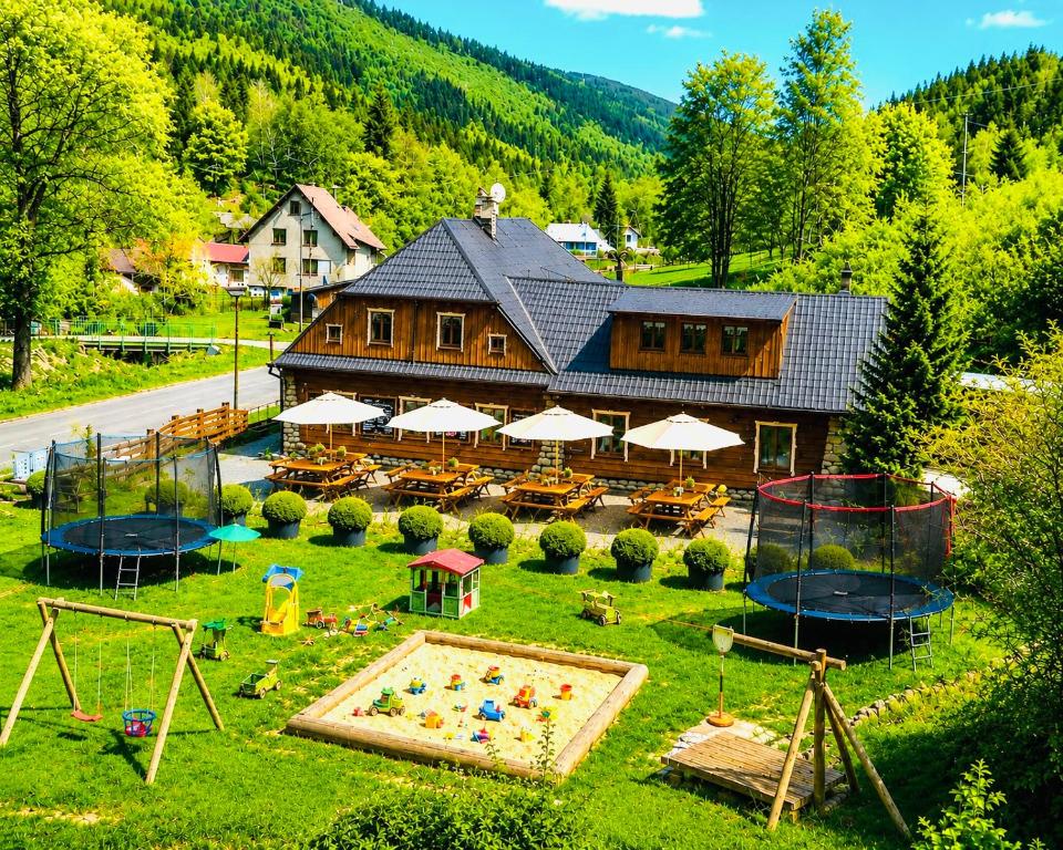 an aerial view of a house with a playground at pension U Jiřího in Ludvíkov