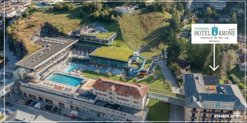 an aerial view of a building with a resort at Thermenhotel Krone - inklusive Felsentherme in Bad Gastein