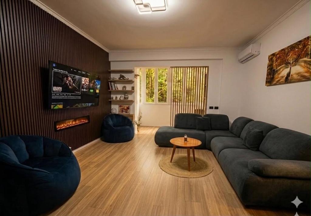 a living room with a couch and a tv at Lake Apartment in Sauk