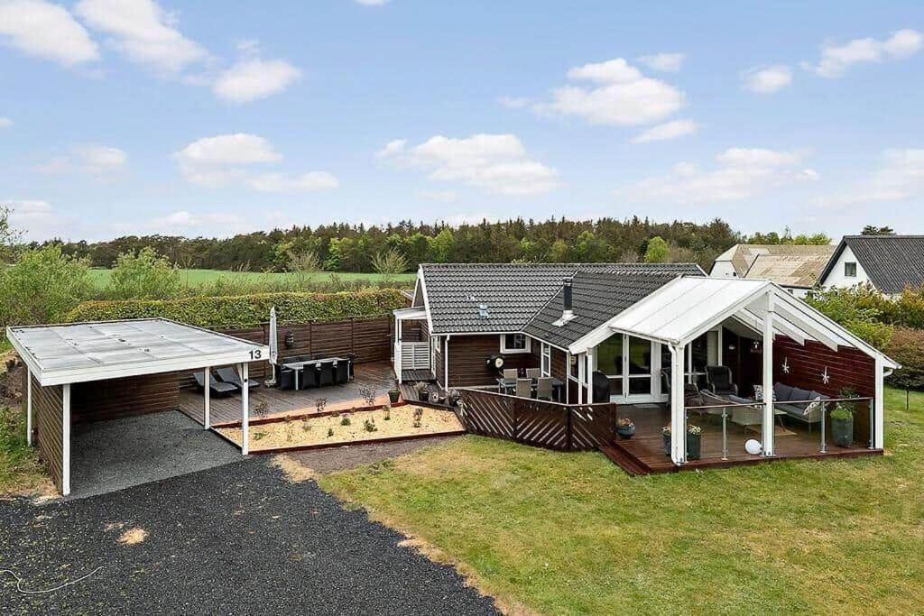 a house with a deck and a pavilion at HA411-Hals-Junovej-13 in Hals