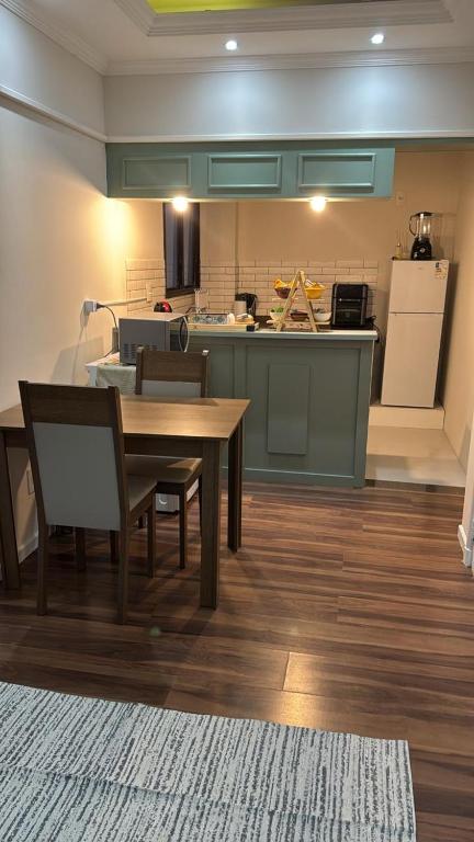a kitchen with a table and chairs in a room at Apartment 22 - Jundiaí in Jundiaí