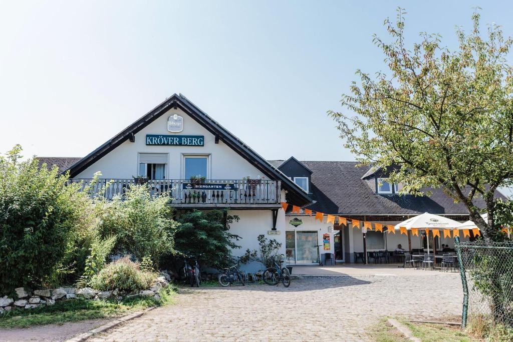 a large white building with a balcony on it at Kröver Berg in Kröv