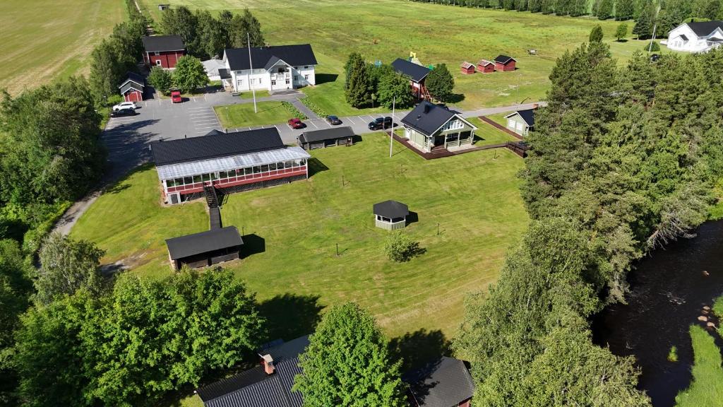 an aerial view of a house on a grass field at Hannuksen Piilopirtti in Tyrnävä