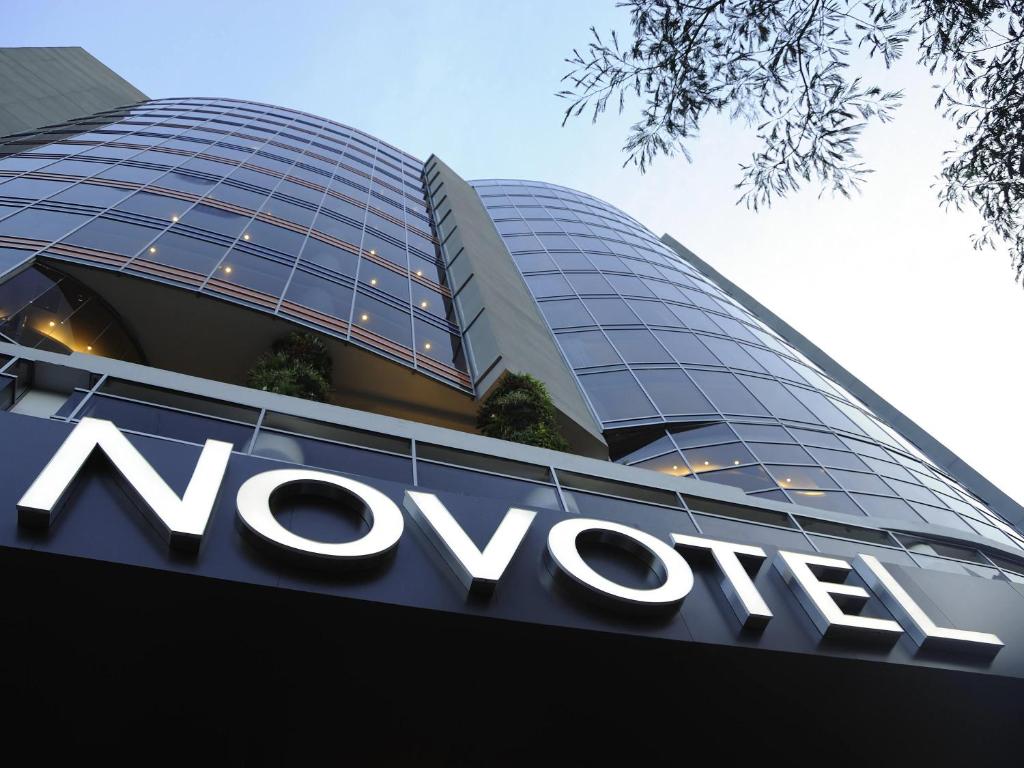 a sign on the front of a vodafone building at Novotel Panama City in Panama City
