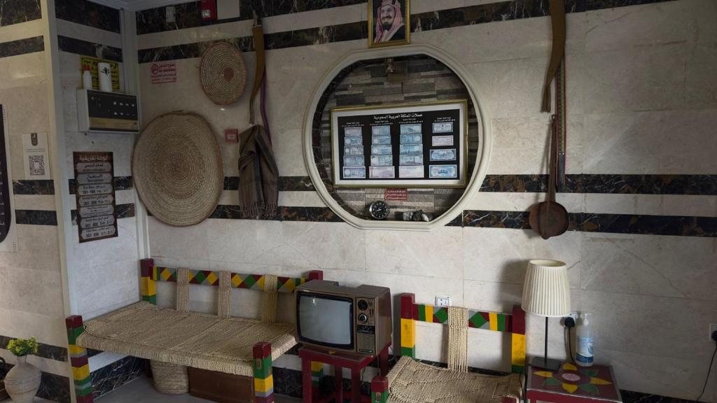 a room with a tv in a lego house at Zahraa Al-Tal in Baljurashi