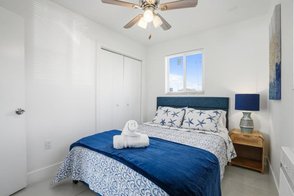 a bedroom with a bed and a ceiling fan at 11432 Lincoln Blvd in Richmond Heights