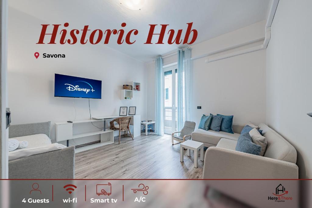 a living room with a couch and a tv at Historic Hub - Crociere a 10 min - AC - WiFi Gratis in Savona