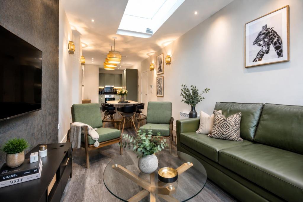 a living room with a couch and a table at The Orpington View in Orpington