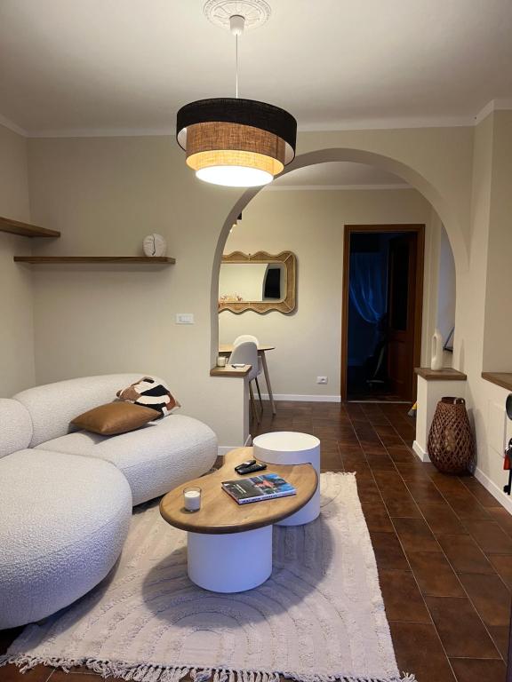 a living room with a couch and a table at Casa Nina in Valbravenna