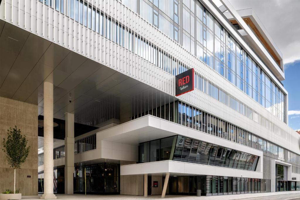 a building with a sign on the side of it at Radisson RED Innsbruck in Innsbruck
