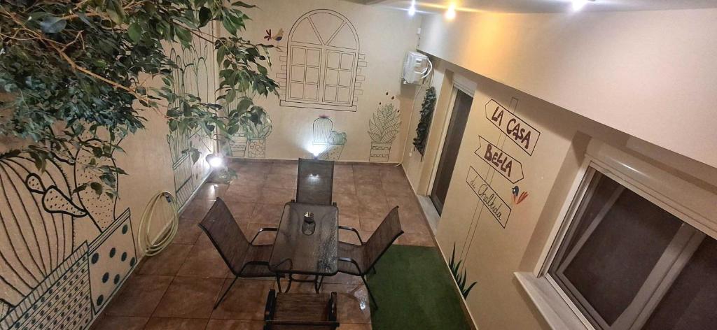 a hallway with a table and chairs in a building at La casa bella di Chalkida in Chalkida