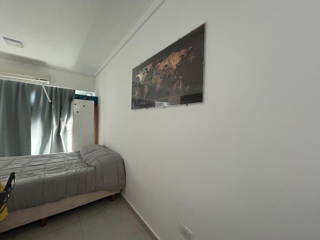 a bedroom with a bed and a painting on the wall at Shackleton in Wilde