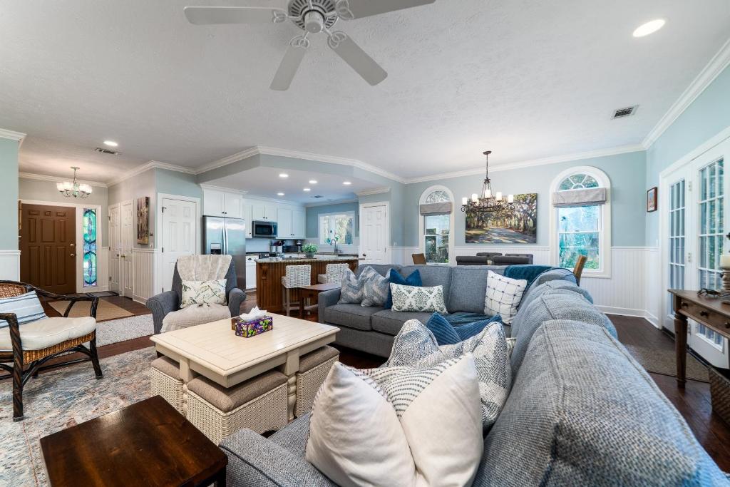 a living room with a couch and a table at 2501 Chateau by the Green in Seabrook Island