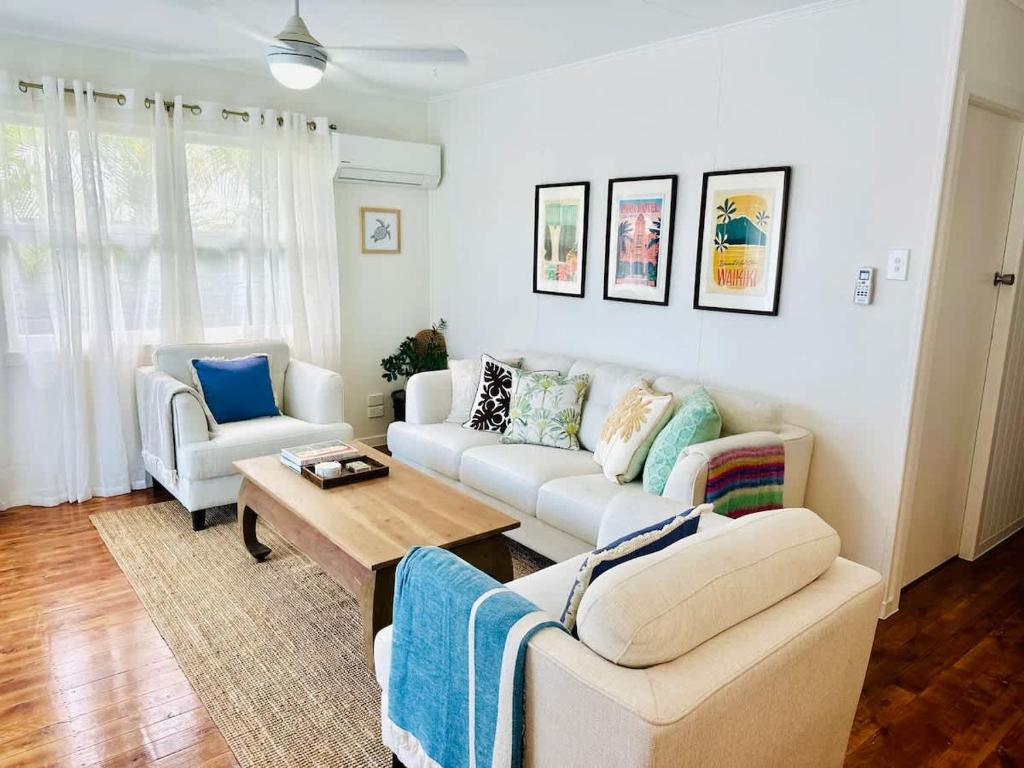 a living room with a couch and a table at Halia in Gold Coast