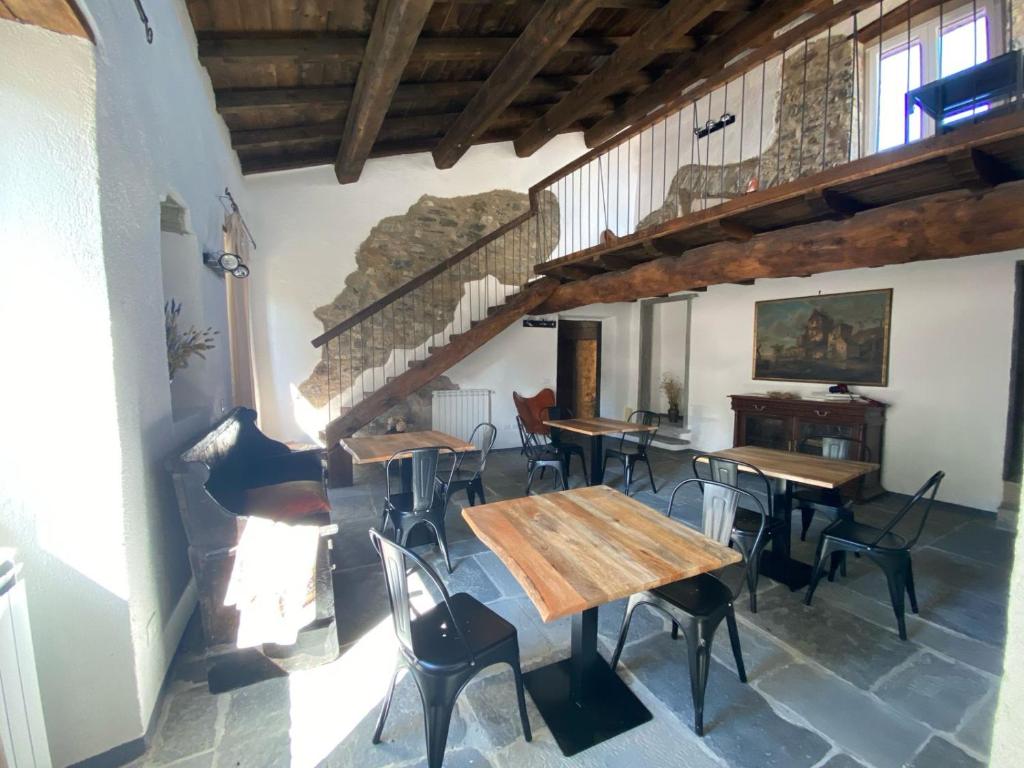 a room with tables and chairs in a building at La Antica Torre in Sasseta