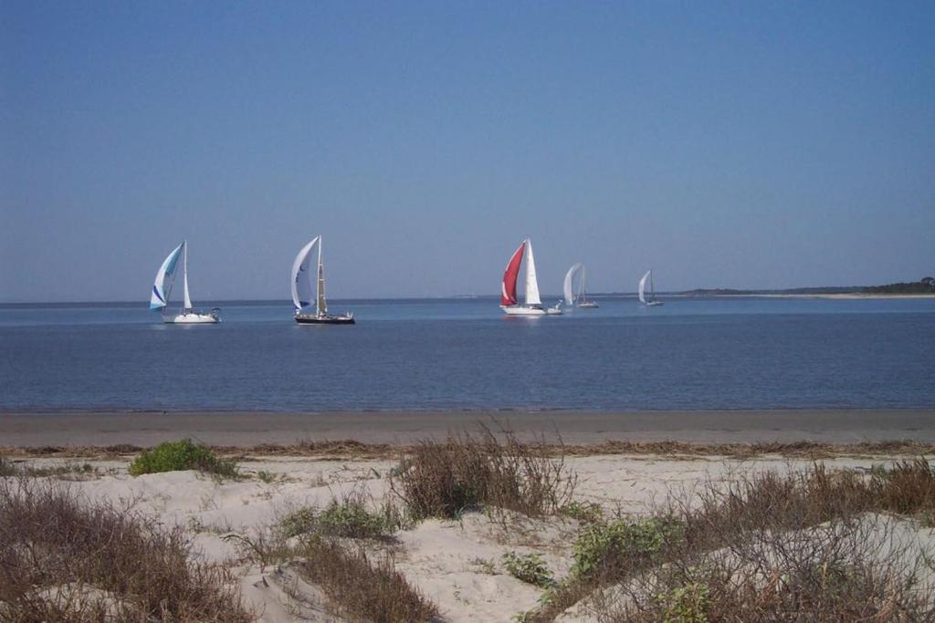 a group of sailboats in the water on a beach at 1340 Pelican Watch Villa in Seabrook Island