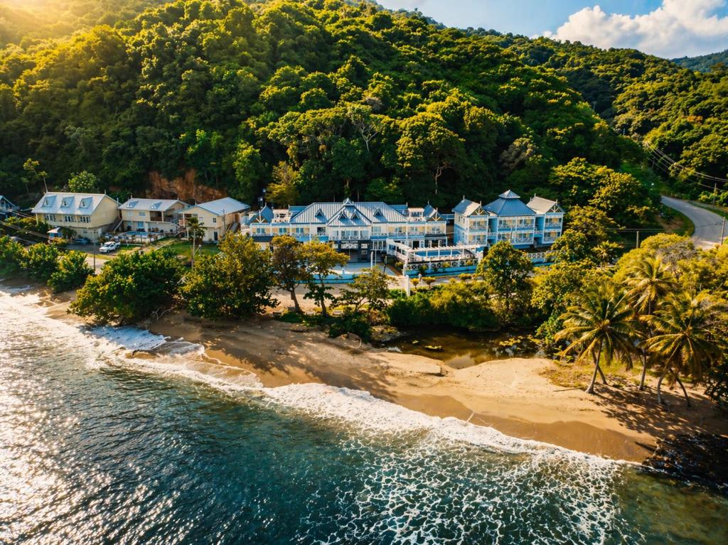 an aerial view of a resort on a beach at Manta Lodge and Dive Centre in Speyside
