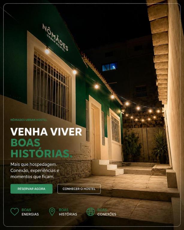 a house with lights on the side of it at Nônames Urban Hostel in Florianópolis