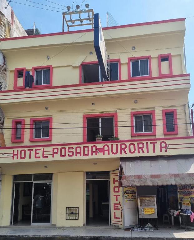 a building with a sign that reads hotel puebla outpost at Hotel Posada Aurorita in Villahermosa