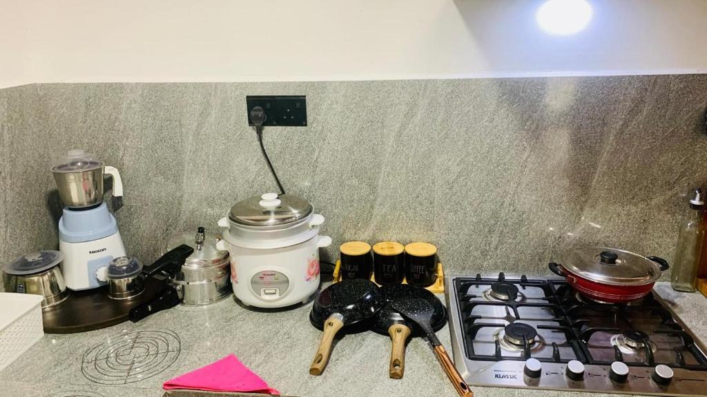 a kitchen counter top with a stove and a stove top at Mayon villa in Midigama East