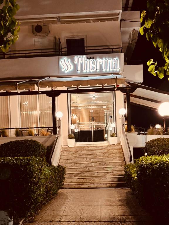 a building with a sign that reads subway firm at Therma Hotel in Loutra Ipatis