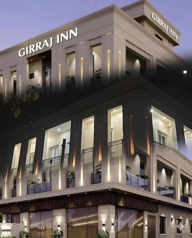 a lit up building with lights on at Hotel Girraj Inn in Vrindāvan
