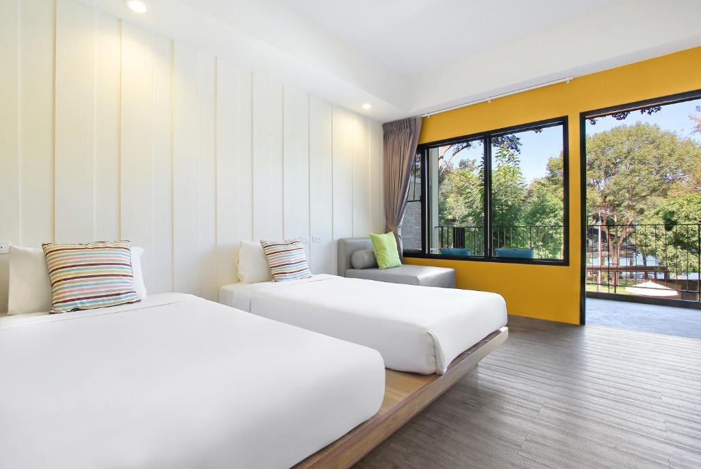 Postel nebo postele na pokoji v ubytování Samed Hideaway Resort