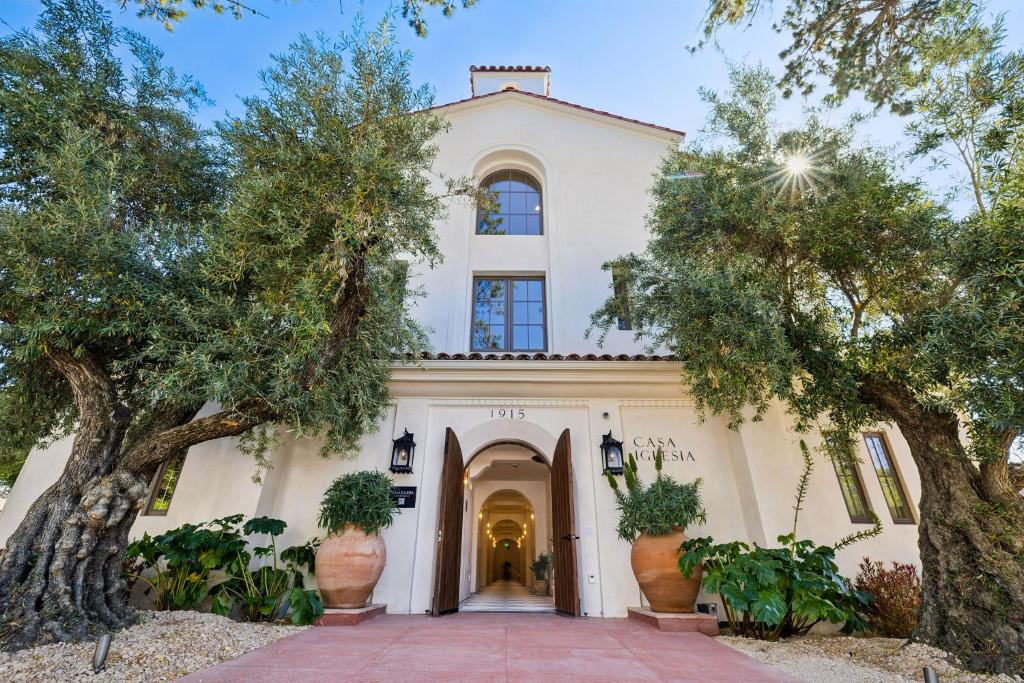 a house with trees in front of it at Casa Iglesia in Santa Barbara