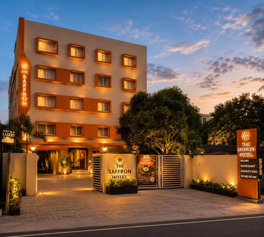 a building with a sign in front of it at The Saffron Hotel in Bhubaneshwar