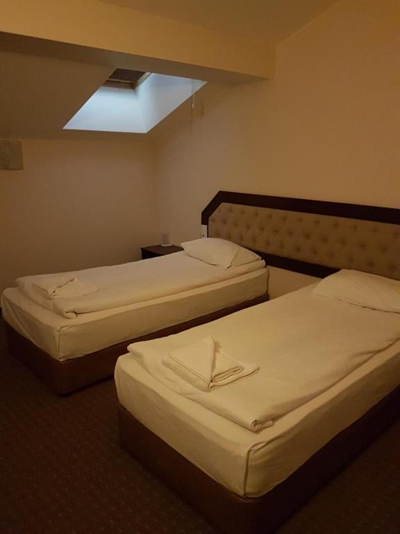 A bed or beds in a room at Hotel Podkovata