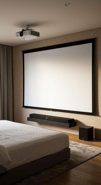 a large projection screen on the wall of a bedroom at Urban Space in Khammam