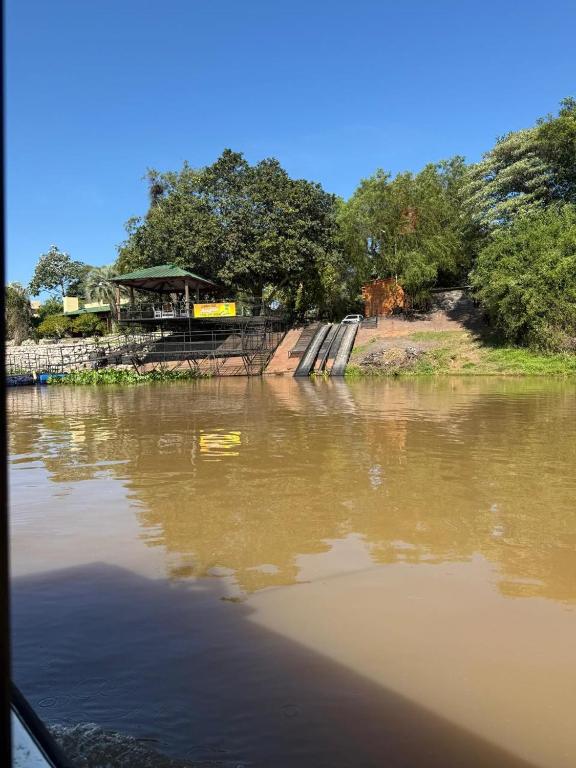 a view of a body of water with a bridge at Cabañas Lodge Angirú in Goya