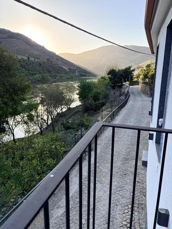 a balcony with a view of a river at Villa Tua in Castanheiro