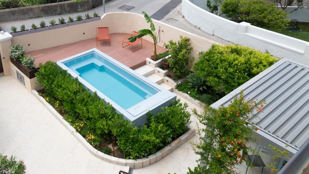 an overhead view of a swimming pool on a house at Domo Andi in La Maddalena